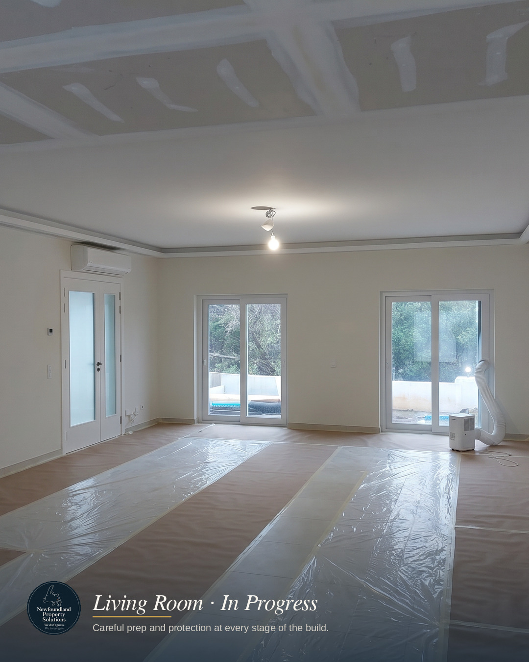 Living room mid-build with floors protected